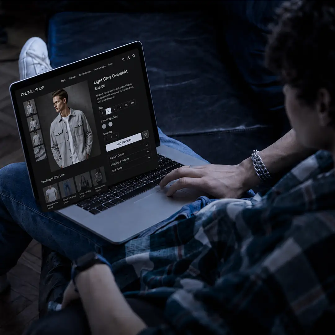 Shopper viewing a clothing product page on a laptop in an online store.