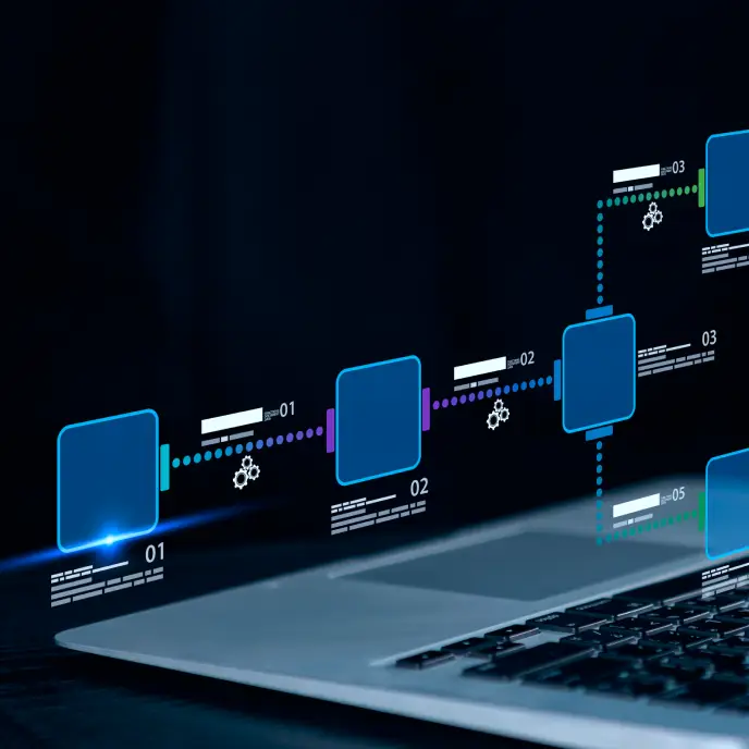 <p>Close-up of a laptop keyboard with a digital workflow or process diagram floating above it, showing connected blue nodes, dotted lines, and small gear icons representing steps in an automated system.</p>