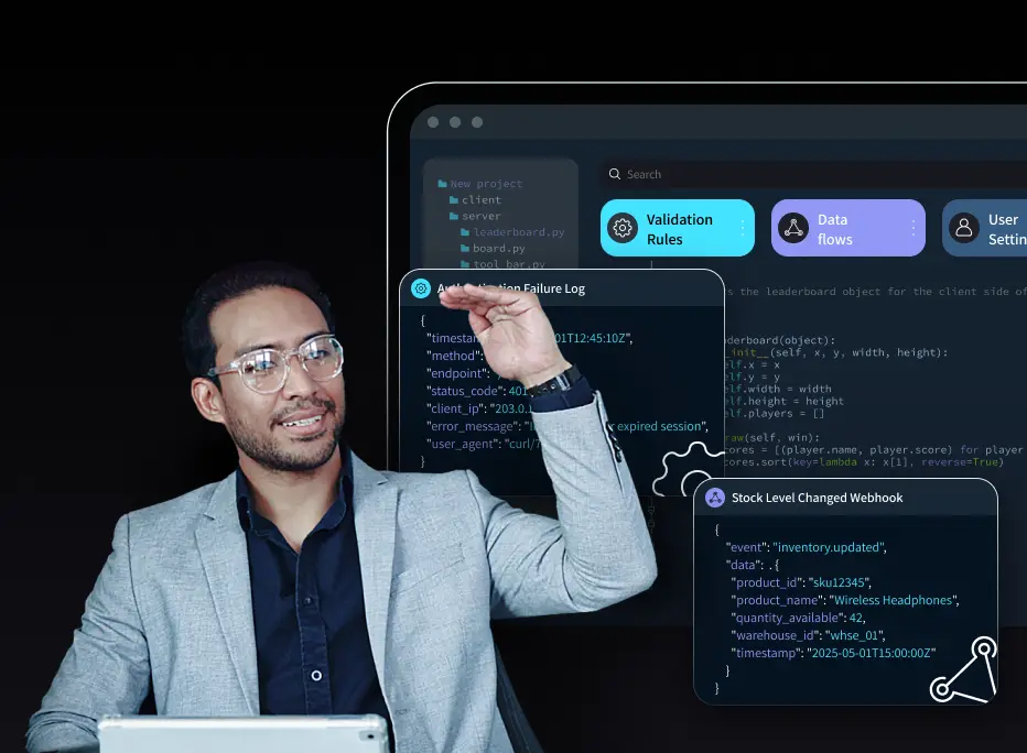 A man wearing glasses and a light gray blazer gestures upward while sitting in front of a tablet. Behind him is a dark-themed software interface displaying code snippets, validation rules, data flow icons, and webhook logs, creating a visual representation of technical development and automation.