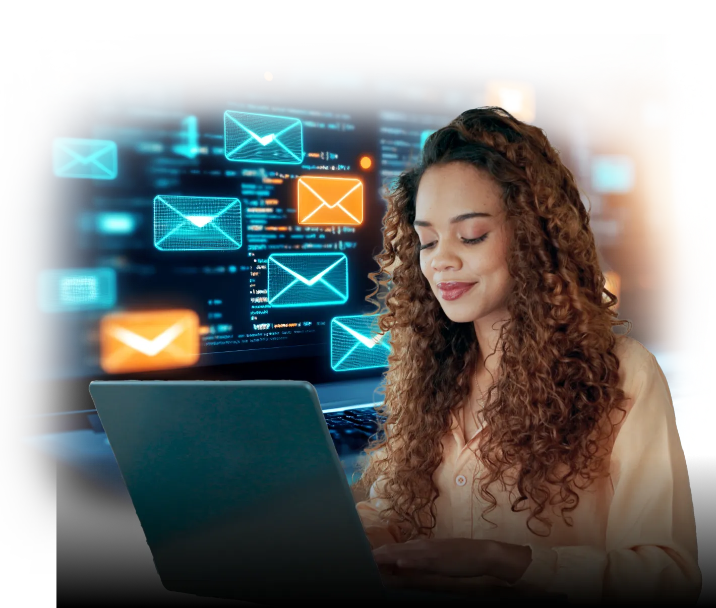 A young woman with curly hair types on a laptop, smiling and focused. Behind her, a large transparent digital interface displays glowing email icons—some blue and some orange—floating above code, suggesting email communication, cybersecurity, or digital messaging technology.