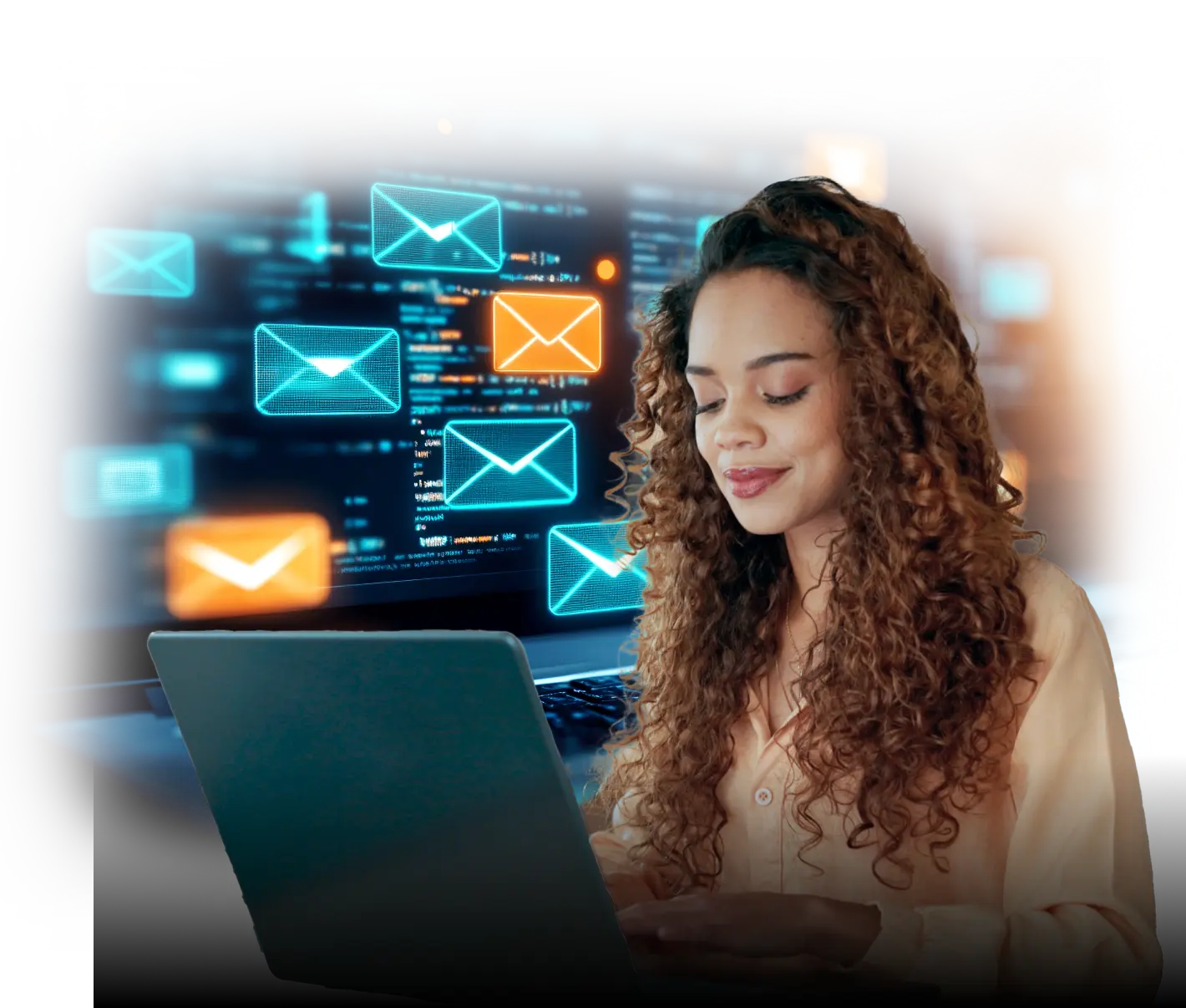 Woman with curly hair using a laptop, smiling, with floating email icons in blue and orange glowing on a large computer screen in the background, representing email communication or marketing.