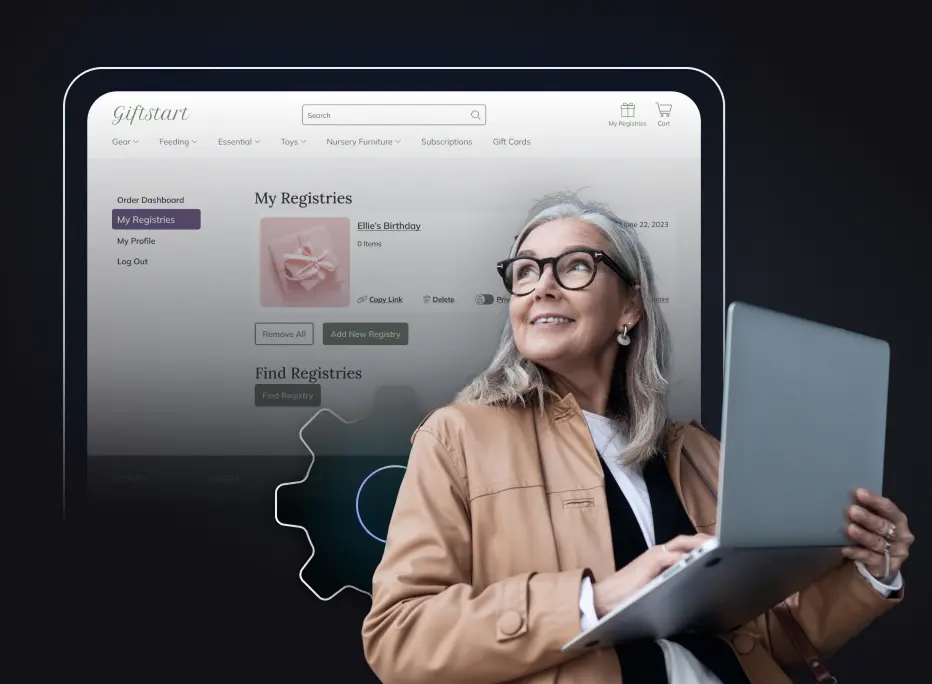 A smiling older woman with gray hair and glasses holds a laptop while looking upward. Behind her is a large screen displaying an online registry dashboard with sections like ‘My Registries,’ ‘My Profile,’ and gift-related categories.