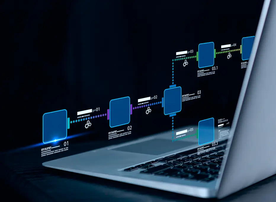 Laptop with a holographic-style digital workflow diagram projected above the keyboard, showing connected blue nodes and data flow steps against a dark background.