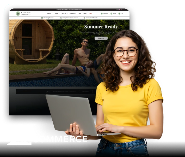 A smiling woman in a yellow shirt holds a laptop in front of a screen displaying the Redwood Outdoors website, which features a summer-themed homepage with people lounging near a wooden sauna and pool. The BigCommerce logo appears in the corner, suggesting success or satisfaction with an e-commerce platform powered by BigCommerce.