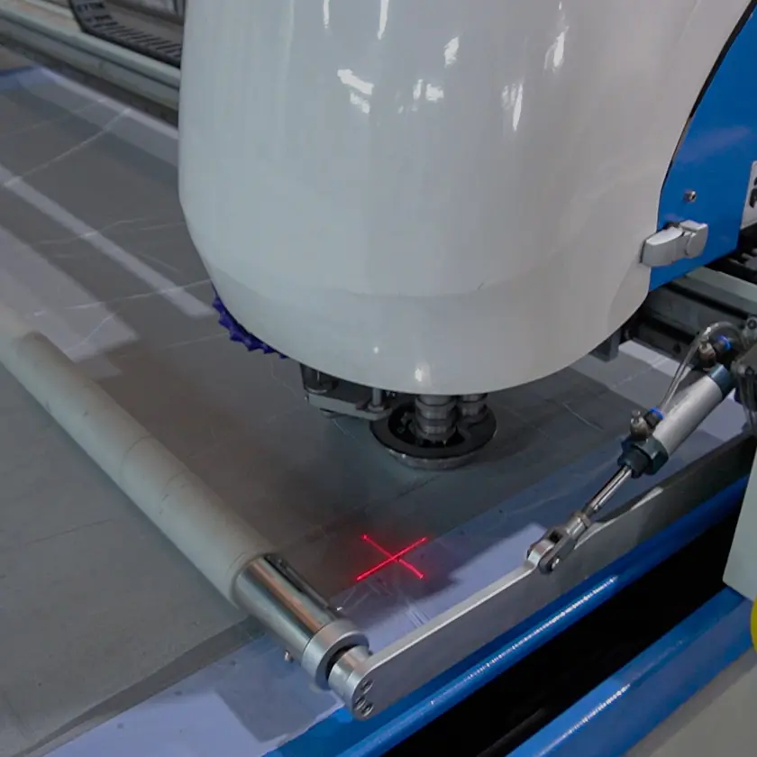 Close-up of an automated cutting machine precisely cutting seat cover material, highlighting Durafit’s manufacturing process and focus on accuracy, consistency, and product quality.