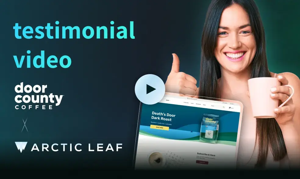Smiling woman holding a pink coffee mug and giving a thumbs-up next to a laptop screen showing Door County Coffee’s Death’s Door Dark Roast product page, with text reading 'testimonial video' and logos for Door County Coffee and Arctic Leaf.