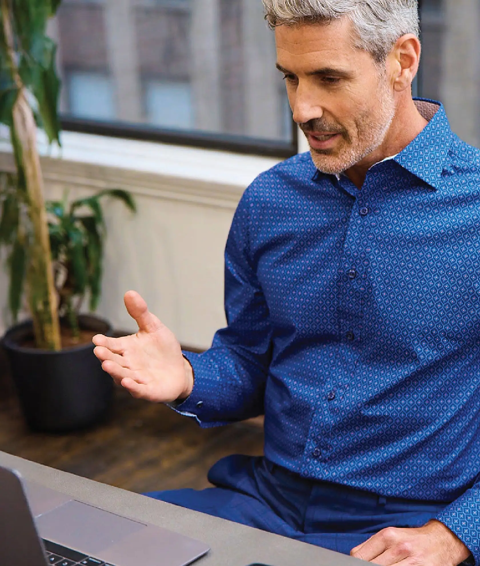 man wearing a blue Nick Graham shirt